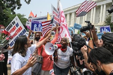 Protesters for and against affirmative action demonstrate outside the U.S. Supreme Court in Washington, June 29