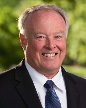Bob Craven smiling in a suit